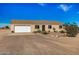 Single-story home featuring a two-car garage, desert landscaping, and a neutral-colored exterior at 2900 E Paloma Rd, Eloy, AZ 85131