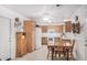 Spacious kitchen and dining area with wooden cabinetry and tile flooring at 2900 E Paloma Rd, Eloy, AZ 85131