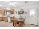 Bright kitchen and dining space with wooden table and chairs at 2900 E Paloma Rd, Eloy, AZ 85131