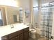 Traditional bathroom featuring a white vanity and shower-tub combination at 3117 S Signal Butte Rd # 480, Mesa, AZ 85212