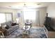 Comfortable living room featuring a ceiling fan, stylish rug, and ample natural light at 3117 S Signal Butte Rd # 480, Mesa, AZ 85212