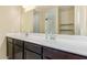 Bathroom featuring double sinks, vanity and large mirror at 3206 N 310Th Ln, Buckeye, AZ 85396