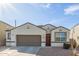 Beautiful single-Gathering home with desert landscaping and a two-car garage at 3206 N 310Th Ln, Buckeye, AZ 85396