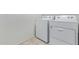 Bright laundry room with a side-by-side, white washer and dryer set at 3206 N 310Th Ln, Buckeye, AZ 85396