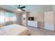 Serene bedroom with a ceiling fan, neutral tones, and a view to the ensuite bathroom at 3215 N Margate Pl, Chandler, AZ 85224