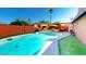 Inviting pool area with lounge chairs, umbrellas, and covered patio, perfect for relaxation and entertaining at 3215 N Margate Pl, Chandler, AZ 85224