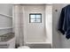 Clean bathroom with tiled shower and subway tile at 345 W Wilshire Dr, Phoenix, AZ 85003