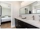 Bathroom featuring dual sinks, framed mirror, and plenty of counter space at 345 W Wilshire Dr, Phoenix, AZ 85003