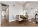 Bright dining room with a table, chairs, and wood-look floors at 345 W Wilshire Dr, Phoenix, AZ 85003