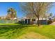 Charming single-story home with white exterior, manicured lawn, and mature tree at 345 W Wilshire Dr, Phoenix, AZ 85003