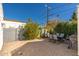 Private backyard patio with lush landscaping and a table provides relaxing outdoor space at 345 W Wilshire Dr, Phoenix, AZ 85003