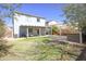 View of a two story home exterior featuring a covered patio, sofa seating, and stone oven at 35771 W Costa Blanca Dr, Maricopa, AZ 85138