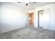 Bedroom with a modern ceiling fan, a closet with sliding doors, and plush carpeting at 35771 W Costa Blanca Dr, Maricopa, AZ 85138