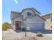 Well-maintained two-story home with neutral paint, a two-car garage, and gravel landscaping at 35771 W Costa Blanca Dr, Maricopa, AZ 85138