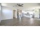 Open concept living room featuring wood floors, white walls and an island kitchen at 35771 W Costa Blanca Dr, Maricopa, AZ 85138