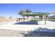 Covered picnic area with tables and BBQ grills, perfect for outdoor gatherings and community events at 35771 W Costa Blanca Dr, Maricopa, AZ 85138