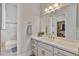 Bathroom featuring a marble counter and view to a walk-in shower at 3937 E Norcroft Cir, Mesa, AZ 85215