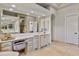 Bright bathroom featuring a makeup table and double sink vanity at 3937 E Norcroft Cir, Mesa, AZ 85215