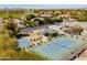 Overhead view of community amenities showcasing a well-kept picnic area, tennis court, and basketball court at 3937 E Norcroft Cir, Mesa, AZ 85215