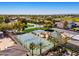 Birds-eye view of meticulously maintained community tennis and basketball courts, surrounded by palm trees and homes at 3937 E Norcroft Cir, Mesa, AZ 85215