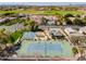 Aerial view of community amenities including tennis courts, a basketball court and lush landscaping at 3937 E Norcroft Cir, Mesa, AZ 85215