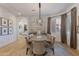 Dining room featuring a spacious table, designer light, and an open floor plan at 3937 E Norcroft Cir, Mesa, AZ 85215