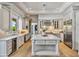 A bright kitchen features a large center island, stainless appliances, and wood flooring at 3937 E Norcroft Cir, Mesa, AZ 85215