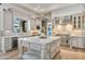 Gourmet kitchen with a large island, marble countertops, stainless steel appliances, and ample storage at 3937 E Norcroft Cir, Mesa, AZ 85215