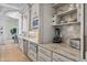 Gourmet kitchen with marble countertops, custom cabinets, and stainless steel appliances, perfect for entertaining at 3937 E Norcroft Cir, Mesa, AZ 85215