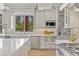 This bright kitchen features stainless appliances and ample storage space at 3937 E Norcroft Cir, Mesa, AZ 85215