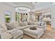 An interior shot of a comfortable living room features a large sectional and stylish decor at 3937 E Norcroft Cir, Mesa, AZ 85215