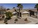 Well-maintained single-story home featuring a two-car garage, desert landscaping, and a tile roof at 40830 W Bedford Dr, Maricopa, AZ 85138