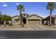 Inviting single-story home featuring desert landscaping, a two-car garage, and charming curb appeal at 40830 W Bedford Dr, Maricopa, AZ 85138