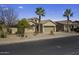 Single Gathering home with desert landscaping, a two car garage, and palm trees at 40830 W Bedford Dr, Maricopa, AZ 85138