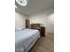 Bedroom featuring wood-look floors, ceiling fan and bright natural light at 4102 E Meadow Dr, Phoenix, AZ 85032