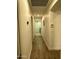 Well-lit hallway with hardwood floors leading to other rooms at 4102 E Meadow Dr, Phoenix, AZ 85032