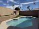 Private backyard with refreshing pool surrounded by lush landscaping and desert views at 4102 E Meadow Dr, Phoenix, AZ 85032