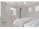 Relaxing bedroom with plush carpet and a view into the bathroom at 4171 E Dublin Ct, Gilbert, AZ 85295