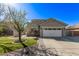 Charming home with a two-car garage, well-maintained lawn, and mature landscaping at 4171 E Dublin Ct, Gilbert, AZ 85295