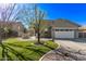 Attractive home exterior featuring a manicured front yard, desert landscaping, and a two-car garage at 4171 E Dublin Ct, Gilbert, AZ 85295