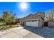 A well maintained house exterior, featuring a front yard, desert landscaping and a two car garage at 4171 E Dublin Ct, Gilbert, AZ 85295