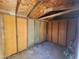 Unfinished basement with exposed wood and wall panels offers potential for customization at 4508 E Alta Vista Rd, Phoenix, AZ 85042