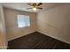 Cozy bedroom with a window letting in natural light and wood floors at 4508 E Alta Vista Rd, Phoenix, AZ 85042