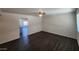 Living room with new wood floors and an open doorway to another room at 4508 E Alta Vista Rd, Phoenix, AZ 85042