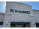 Exterior view of the Pet Market storefront with green signage at 4850 E Desert Cove Ave # 333, Scottsdale, AZ 85254