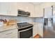 Updated kitchen featuring stainless steel appliances and Herringbone tile backsplash at 4850 E Desert Cove Ave # 333, Scottsdale, AZ 85254