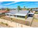 Charming single-story home with a screened porch and a covered parking area at 4929 W Christy Dr, Glendale, AZ 85304