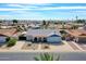 Aerial view of a single-Gathering home featuring a well-manicured lawn at 4929 W Christy Dr, Glendale, AZ 85304