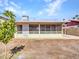 Enclosed back porch with screened windows creates the perfect space for indoor/outdoor living at 4929 W Christy Dr, Glendale, AZ 85304