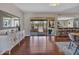 Sunlit dining area with hardwood floors, a patio view and a stylish buffet at 4929 W Christy Dr, Glendale, AZ 85304